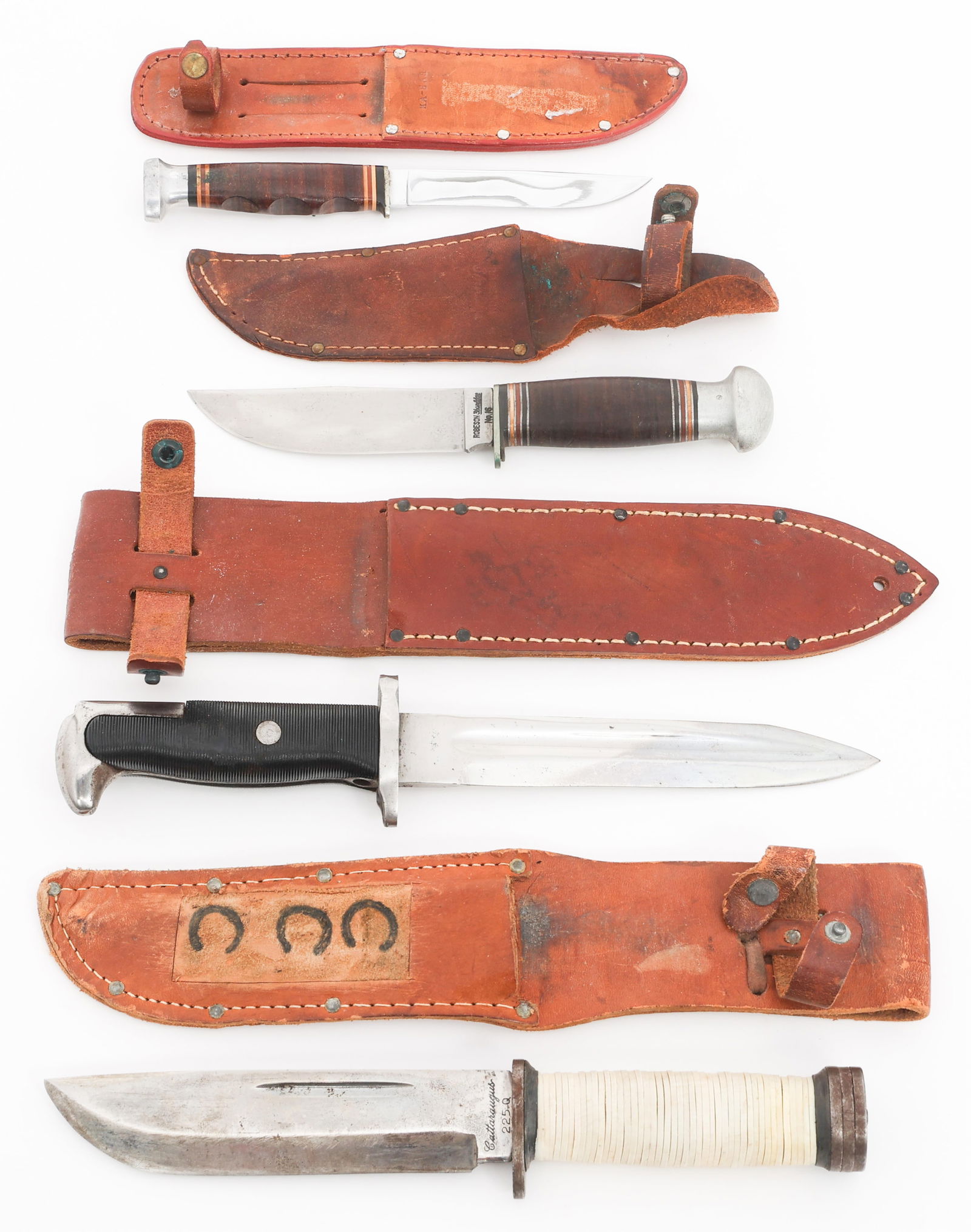 WWII - COLD WAR UTILITY KNIVES & CUT DOWN BAYONET: WWII - COLD WAR UTILITY KNIVES & CUT DOWN BAYONET WWII - Cold War US Utility and Cut Down M1 Bayonet. (1) Cut Down M1 Bayonet. No visible marks. Steel hilt with composite grips. Leather sheath. (1) Ut