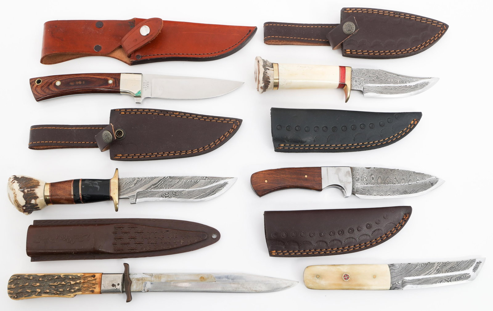FIXED BLADE & FOLDING KNIVES: FIXED BLADE & FOLDING KNIVES Fixed Blade and Folding Knives. (3) Fixed Damascus Blade Knives. (1) Fixed Damascus Blade Tanto. (1) Fixed Blade Knife. Marked Seki Japan. (1) Folding Knife. Marked Stainl