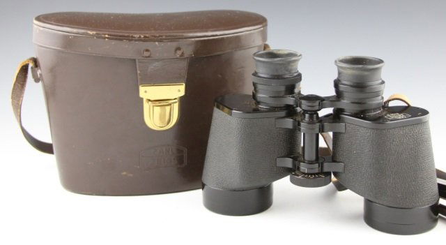 CARL ZEISS 8X50 B BINOCULARS AND LEATHER CASE: CARL ZEISS 8X50 B BINOCULARS AND LEATHER CASE Pair of Carl Zeiss 8x50B Binoculars manufactured in Germany. Adjustable eyepieces and zoom. Adjustable strap to binoculars and case each. Leather case wit