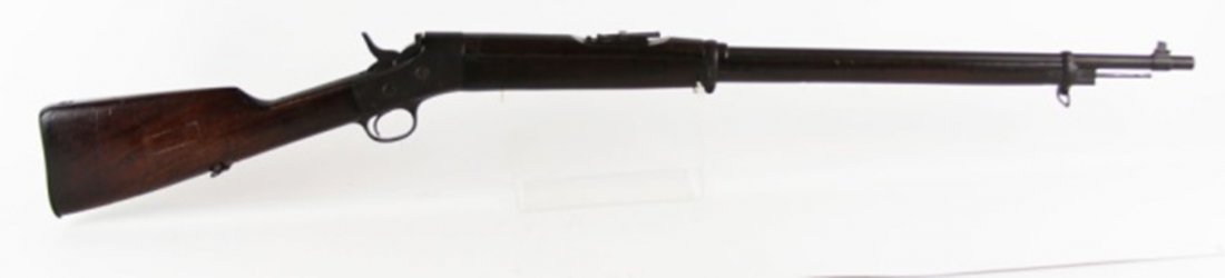 REMINGTON MODEL 1879 ROLLING BLOCK RIFLE: REMINGTON MODEL 1879 ROLLING BLOCK RIFLE Remington Model 1879 Rolling Block Rifle chambered for 7mm rounds. Breech-loading center fire. Segmented wood stock on steel barrel and receiver. Swivel sling 