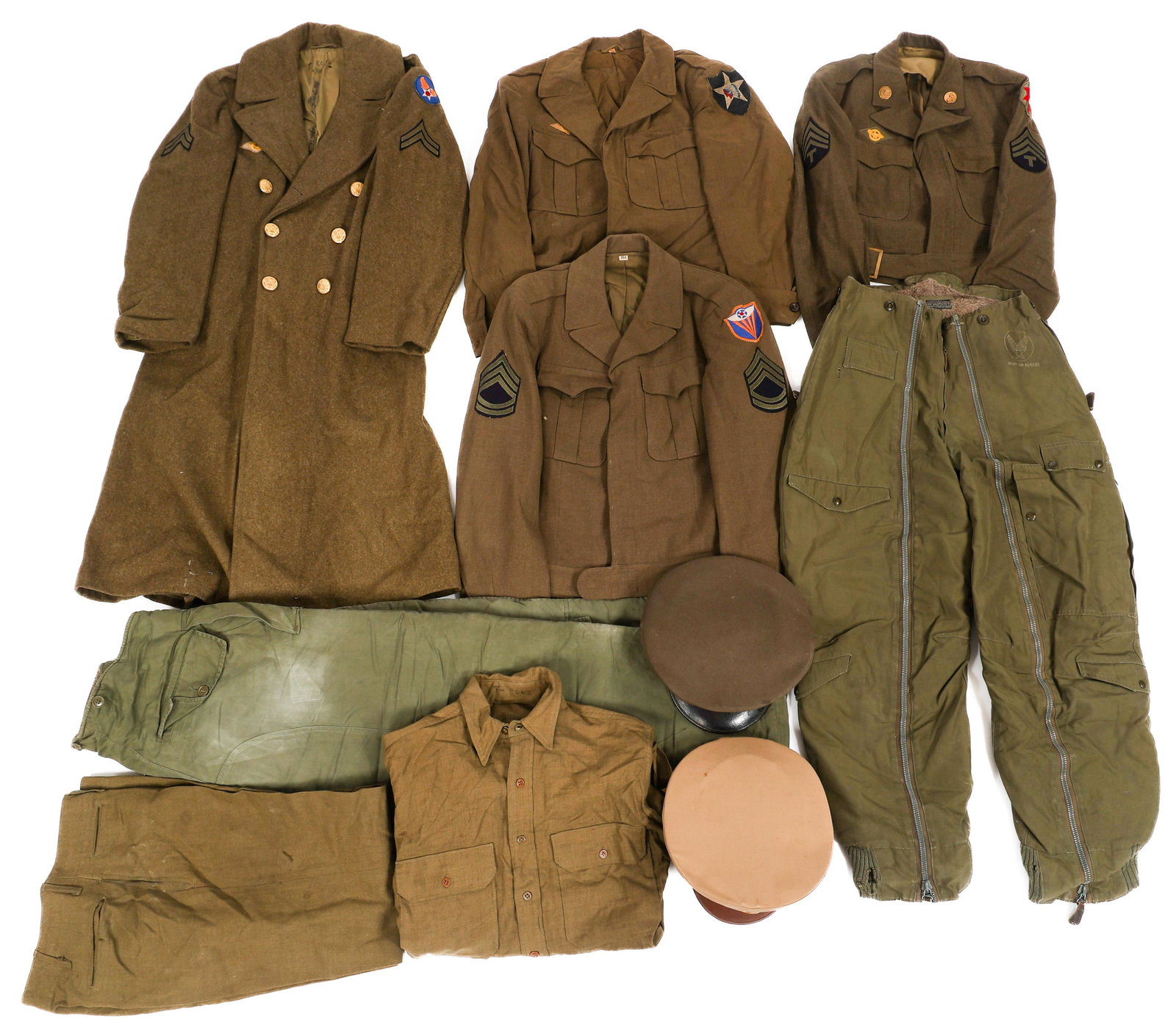 WWII US ARMY EM/NCO UNIFORMS & HEADGEAR: WWII US ARMY EM/NCO UNIFORMS & HEADGEAR WWII US Army Enlisted Man / NCO Uniforms and Headgear. Includes; Enlisted Man winter overcoat with AAF patch, (3) Enlisted Man / NCO's Ike jacket with various u