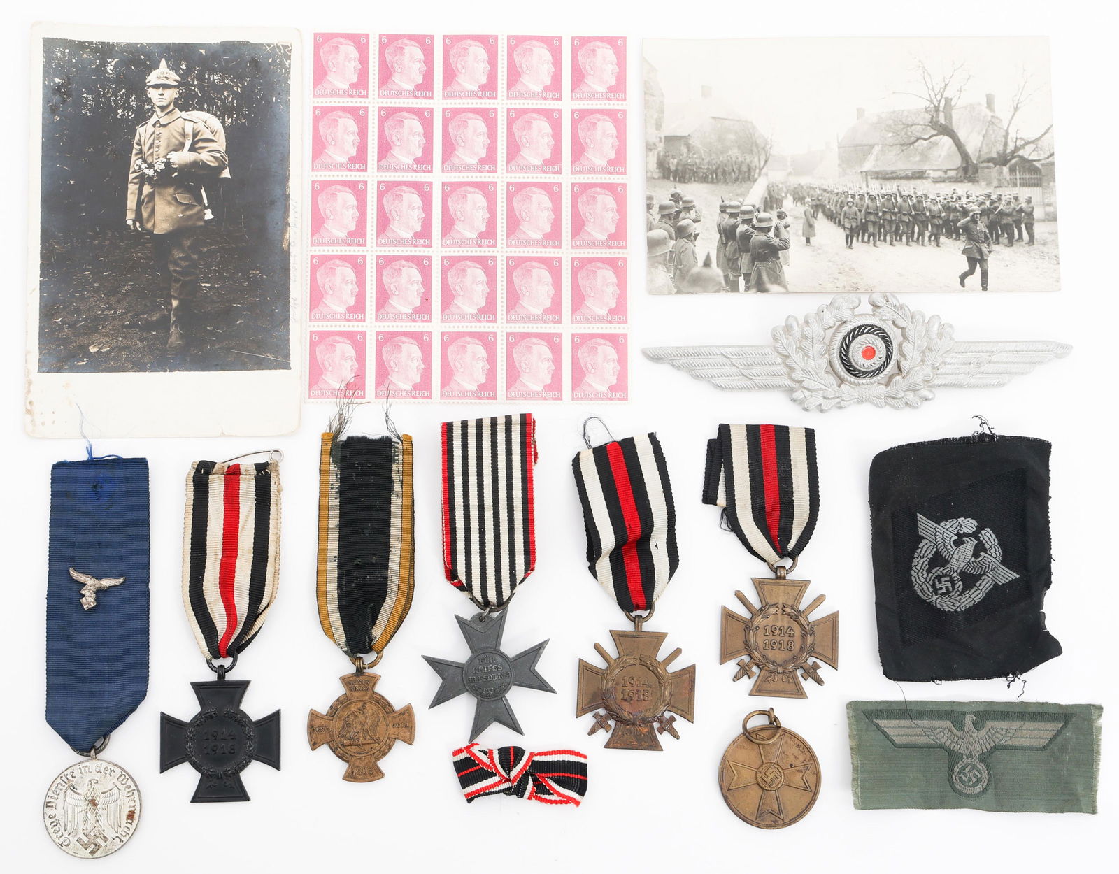 WWI - WWII GERMAN HITLER POSTAGE STAMPS & MEDALS: WWI - WWII GERMAN HITLER POSTAGE STAMPS & MEDALS WWI - WWII German Hitler Postage Stamps & Medals. (1) Sheet of Twenty-Five Hitler 6 Pfennig Stamps. (2) WWI Military themed postcards. (1) Luftwaffe me