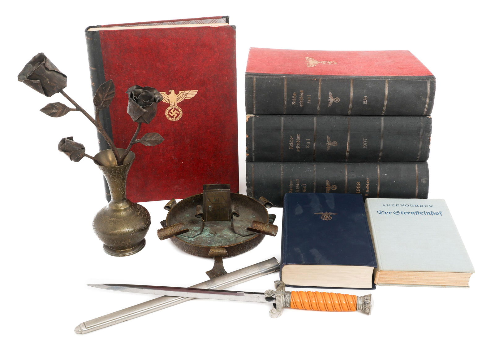 WWII GERMAN PANZER OFFICERS DESK GROUPING: WWII GERMAN PANZER OFFICERS DESK GROUPING WWII German Panzer Officers Desk Grouping of Books, Dagger, Trench Art, and Mein Kampf. (1) WWII German M1935 Officers Dagger with Scabbard. (1) 1935 Edition
