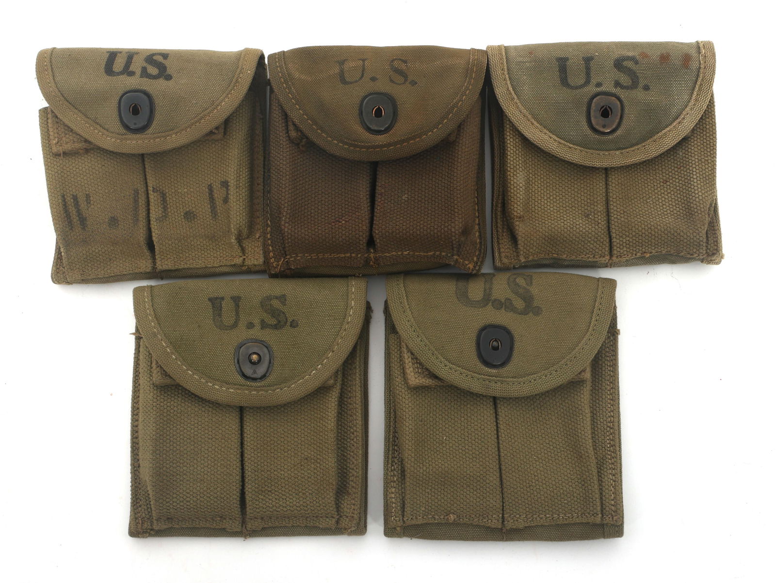 WWII US M1 CARBINE TYPE 1 MAGAZINE POUCHES: WWII US M1 CARBINE TYPE 1 MAGAZINE POUCHES Five WWII US M1 Carbine Type 1 magazine pouches. (1) Stamped Hoff - 1943 on back. S in triangle stamped on snap. (1) Stamped Victory - 1943 on back. (1)