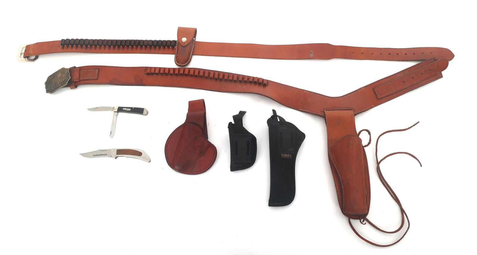 VIKING & HUNTER LEATHER GUN HOLSTER BELTS: VIKING & HUNTER LEATHER GUN HOLSTER BELTS Leather gun holster belts, nylon handgun holsters, and two pocket knives. Viking Model 7026 38XL belt. Hunter 145 XLG belt. Buck model 314X pocket knife. 3.25