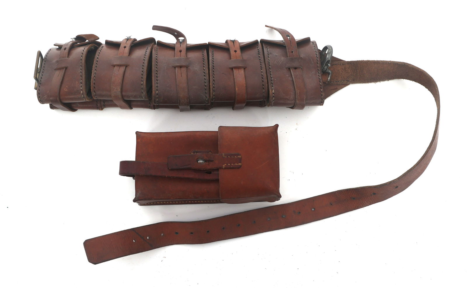 SWISS M1910 BANDOLIER AND MAGAZINE POUCH: SWISS M1910 BANDOLIER AND MAGAZINE POUCH Swiss M1910 bandolier and magazine pouch. Magazine pouch stamped maker cartouche and Swiss cross cartouche. Note: Shipping & Payment Shipping: In-house