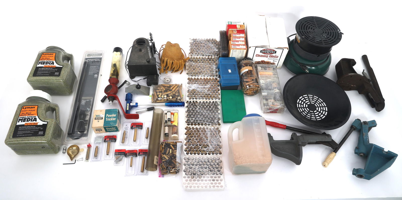 RELOADING PRESS, DIES, AND TUMBLER: RELOADING PRESS, DIES, AND TUMBLER Large lot of reloading press, dies, vibration tumbler, powder trickle, mixed caliber brass and more. Note: Shipping & Payment Shipping: In-house shipping is