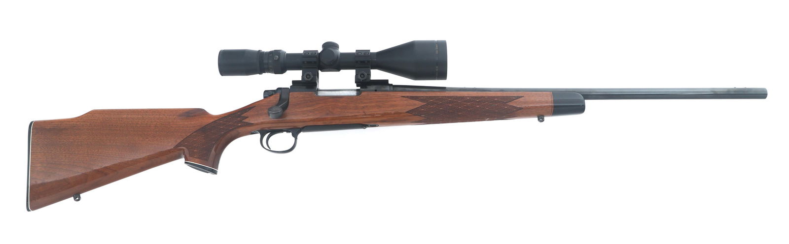 REMINGTON MODEL 700 6mm REM CALIBER RIFLE: REMINGTON MODEL 700 6mm REM CALIBER RIFLE Remington Model 700 6mm Rem caliber bolt action rifle. RD date code. Blued finish. Simmons Pro 50 2.5-10x50 power scope with duplex reticle. Checkered wood st