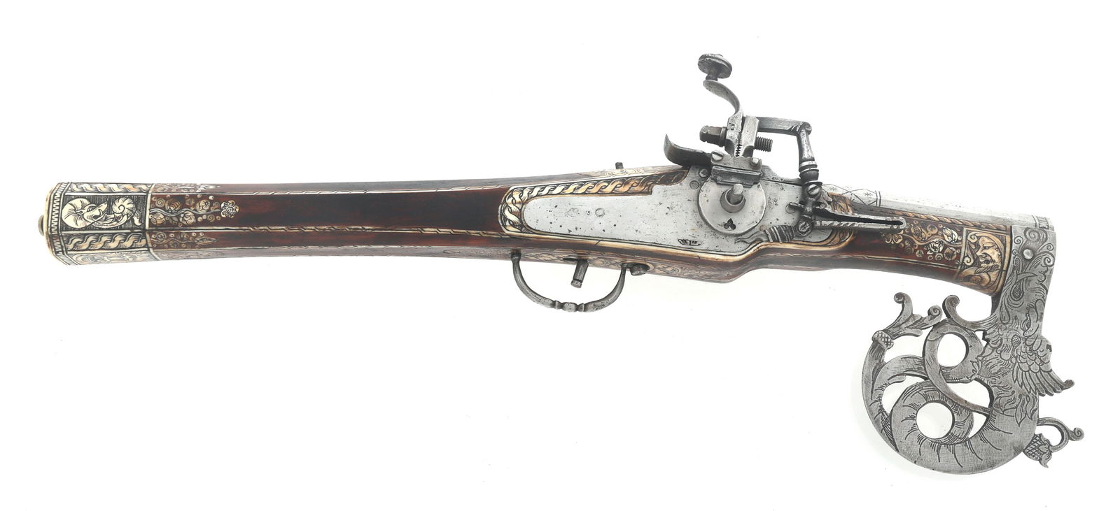 16 BORE WHEELLOCK & AXE COMBINATION PISTOL: 16 BORE WHEELLOCK & AXE COMBINATION PISTOL Combination axe and 16 bore wheellock pistol. Star and diamond checkering on barrel. Intricate Germanic theme bone inlay in stock. Figural dragon axe head me