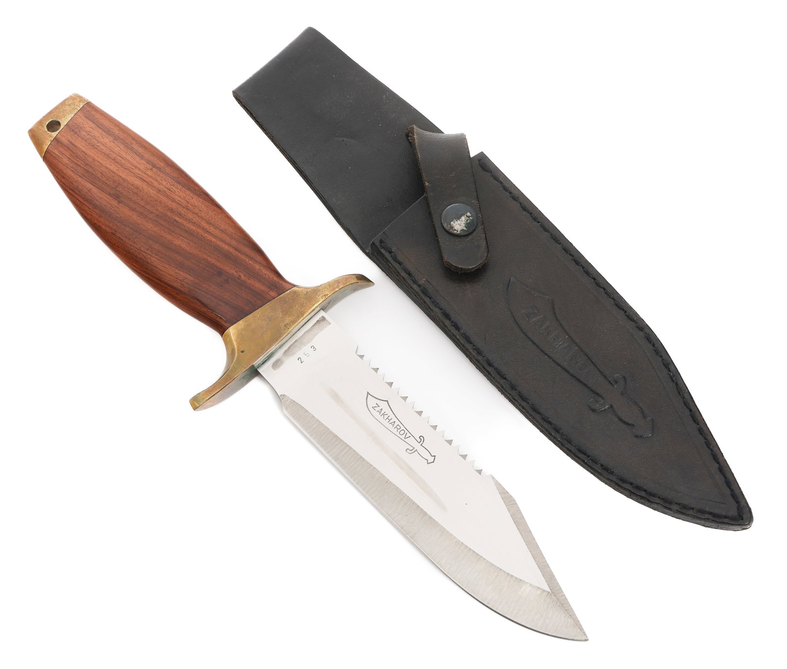 CUSTOM BOWIE KNIFE by ZAKHAROV KNIVES: CUSTOM BOWIE KNIFE by ZAKHAROV KNIVES Custom Bowie Knife. Single edged, bright blade with serrated spine. Maker marked by Zakharov Knives on the blade, serial numbered 253 on the ricasso. Brass hilt w