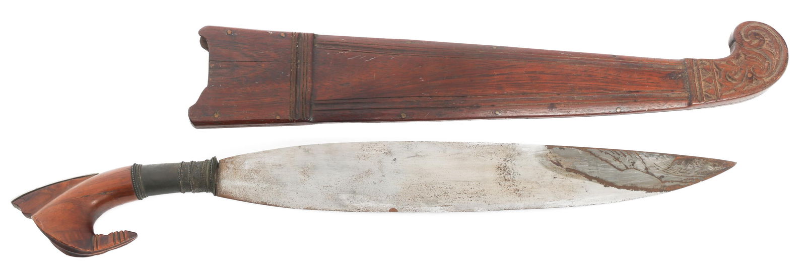 SOUTHEAST ASIAN BARONG WITH SCABBARD: SOUTHEAST ASIAN BARONG WITH SCABBARD Southeast Asian Barong with Scabbard. Single edged, leaf shaped blade. Brass and wood handle. Wooden scabbard. Blade Length: 16 1/2" Total Length: 22 1/2" Note: Sh