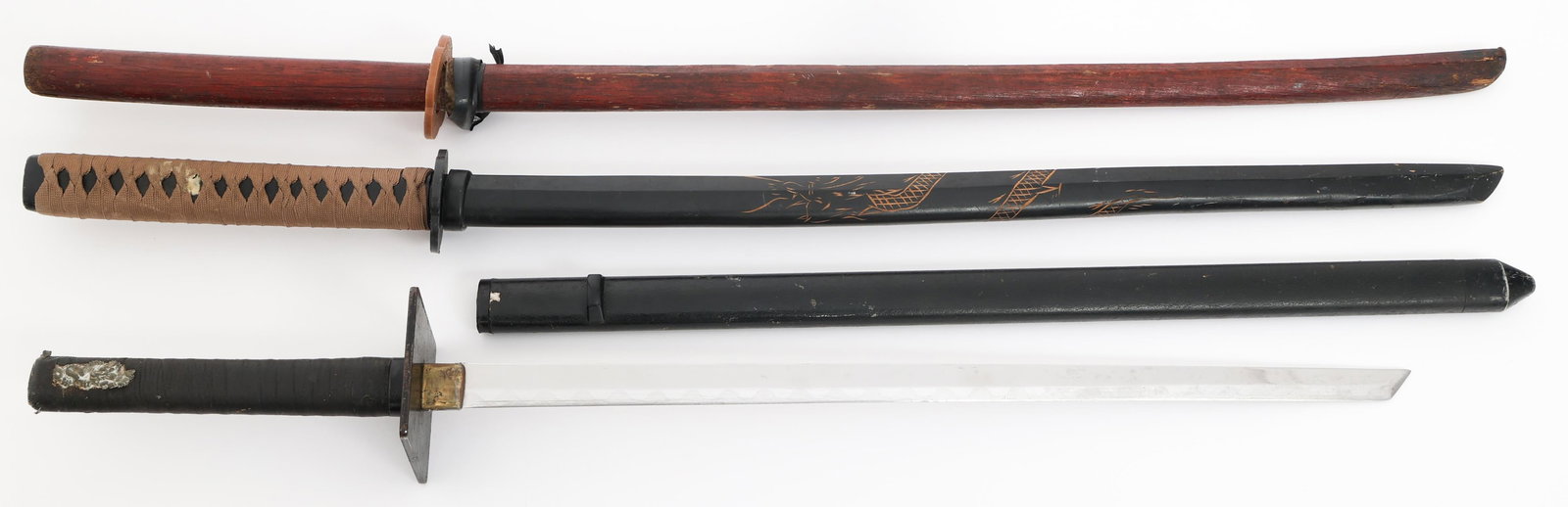 MODERN REENACTOR & WOODEN KATANAS: MODERN REENACTOR & WOODEN KATANAS Modern Reenactor and Wooden Katanas. (2) Wooden Katana. Plastic Tsubas. One with fabric wrapped Tsuka. (1) Modern Katana. Single edged blade with Gunome Hamon. Iron T