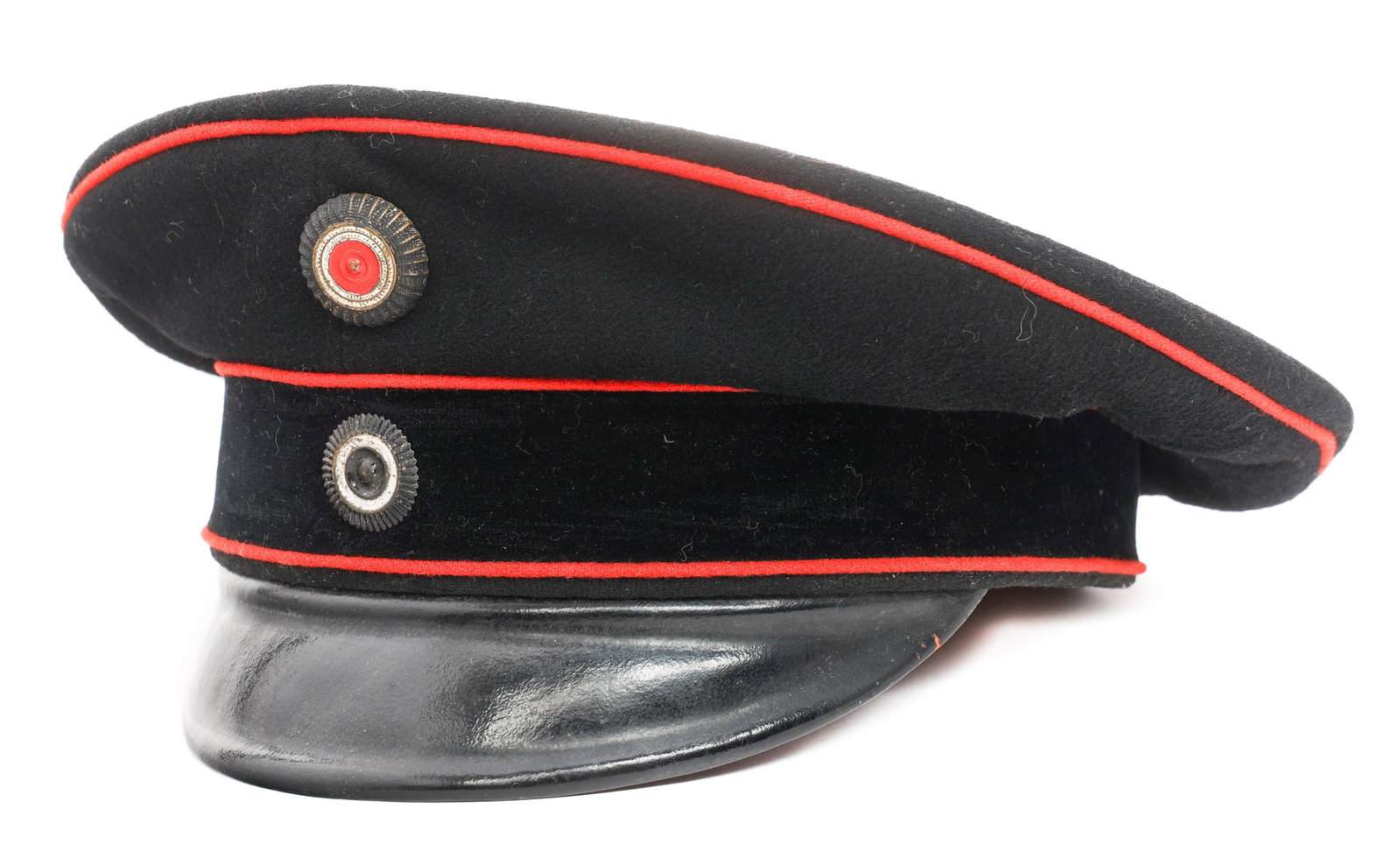 IMPERIAL GERMAN MOTORIZED TROOPS SCHIRMMUTZE CAP: IMPERIAL GERMAN MOTORIZED TROOPS SCHIRMMUTZE CAP Imperial German Motorized Troops Enlisted/NCO Schirmmutze Cap. Black wool with red piping and black cap band. Painted Prussian and National cockades. L