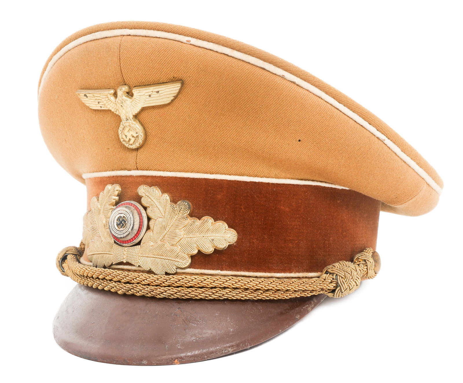 WWII GERMAN NSDAP KREIS LEVEL LEADER VISOR CAP: WWII GERMAN NSDAP KREIS LEVEL LEADER VISOR CAP WWII German NSDAP Kreis Level Leader Visor Cap. Tan wool gabardine with white waffenfarbe. NSDAP Eagle and wreathed cockade gilded aluminum cap badges. B