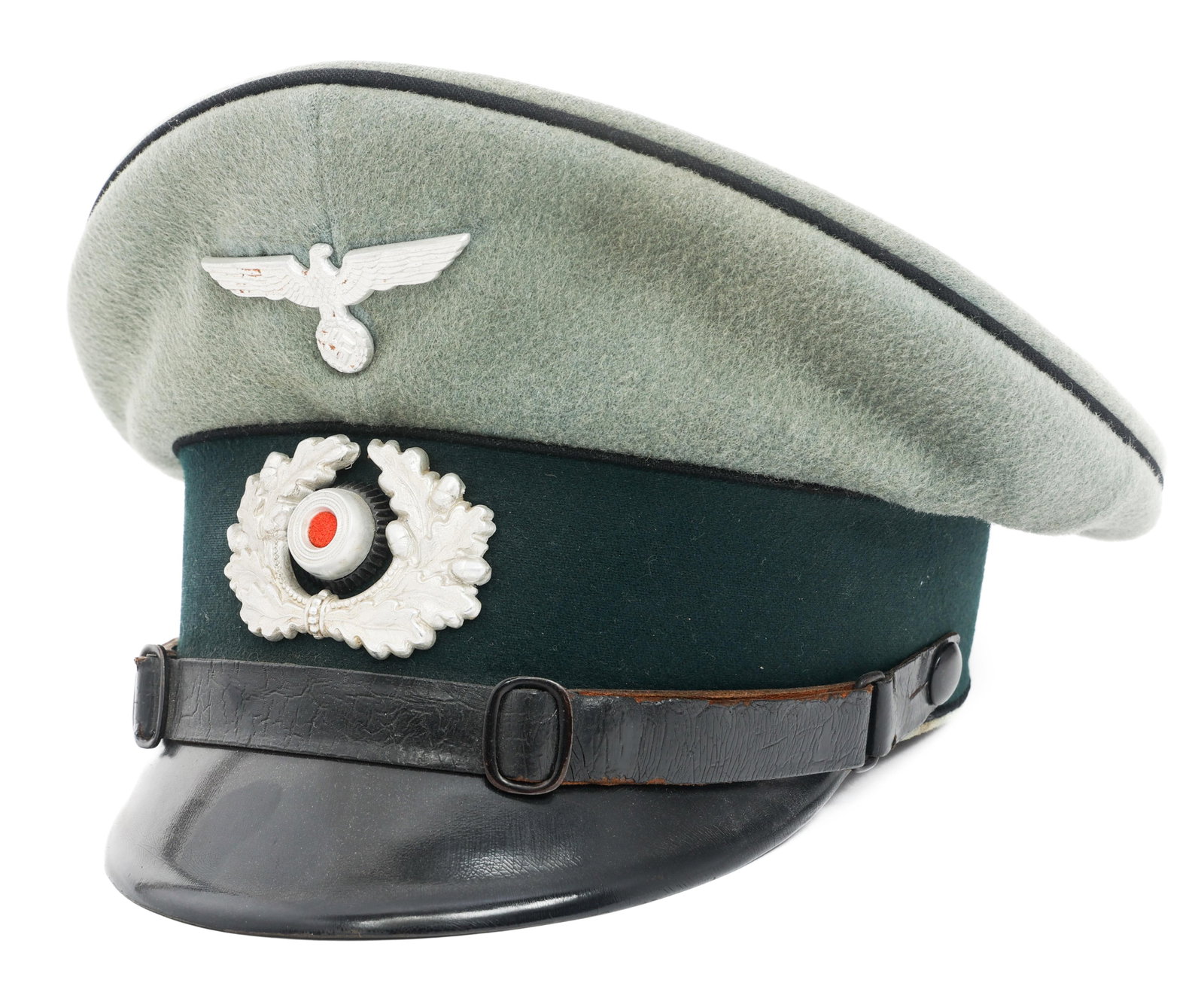 WWII GERMAN HEER PIONEER NCO VISOR CAP: WWII GERMAN HEER PIONEER NCO VISOR CAP WWII German Heer Pioneer NCO Visor Cap. Feldgrau wool with black felt waffenfarbe. Heer Eagle and wreathed aluminum cockade cap badges. Double buckle leather chi