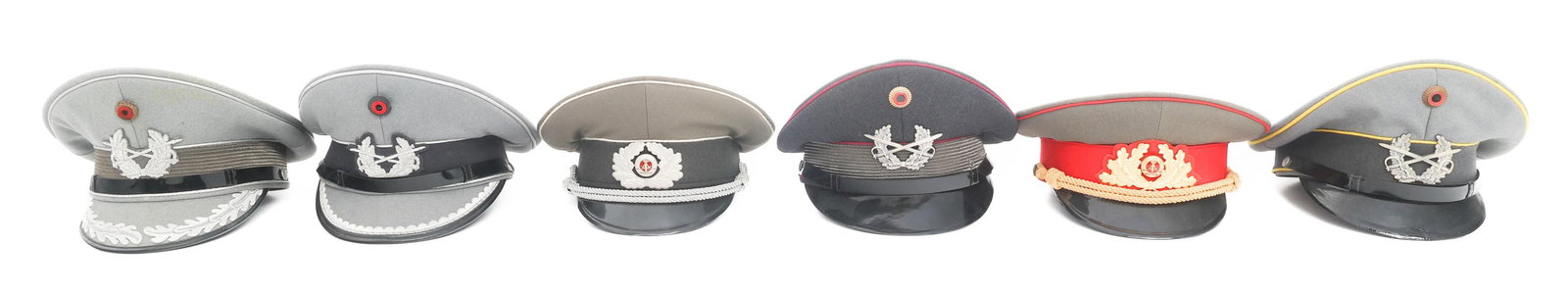 COLD WAR EAST & WEST GERMAN VISOR CAPS: COLD WAR EAST & WEST GERMAN VISOR CAPS Cold War East and West German Officer and Enlisted Visor Caps. Various maker marks, some with names on tags. Services include West German Army Branches, East Ger