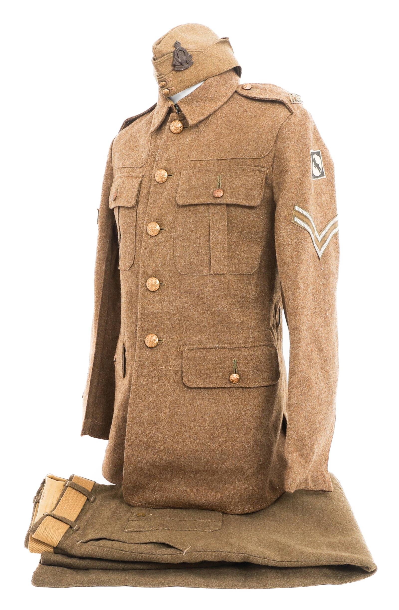 WWII UK RAOC CORPORAL UNIFORM & GARRISON CAP: WWII UK RAOC CORPORAL UNIFORM & GARRISON CAP WWII UK Royal Army Ordnance Corps Corporal Uniform. (1) Garrison Cap. Gabardine with RAOC front badge. (1) Tunic. Wool with gilded brass buttons. Sindall B