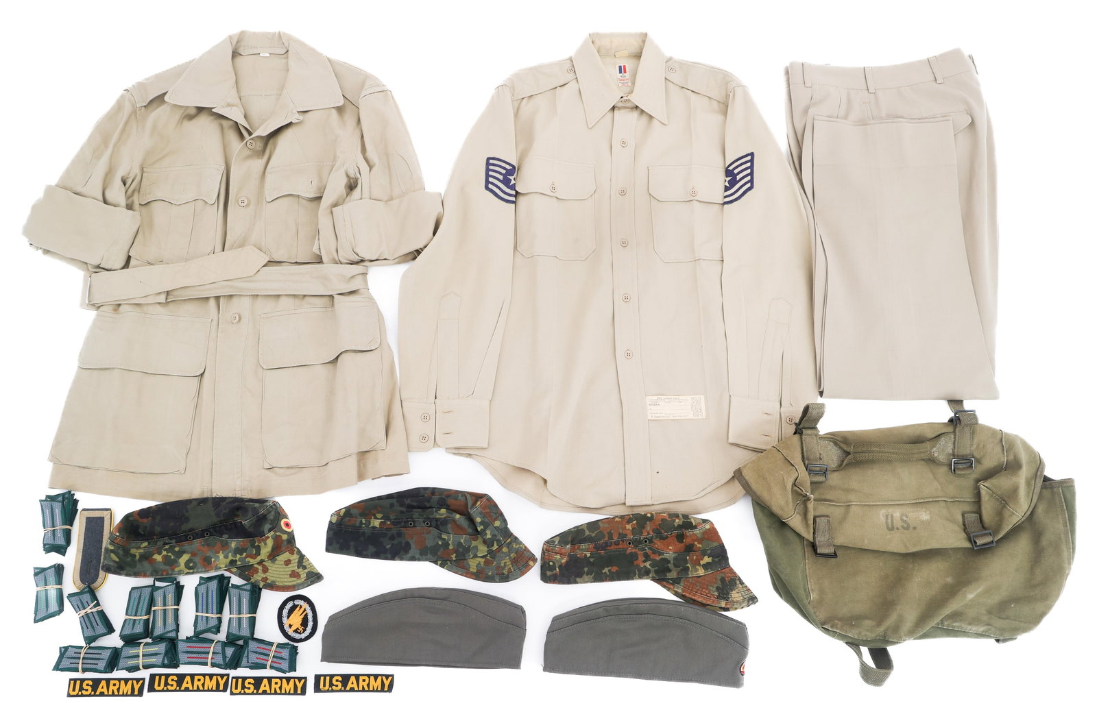 WWII - COLD WAR US & EAST GERMAN UNIFORM ITEMS: WWII - COLD WAR US & EAST GERMAN UNIFORM ITEMS WWII - Cold War US & East German Uniform items. (1) Korean War Tropical Cotton Jacket. Size 42. Tags present. Includes service trousers and shirt. (1) M1