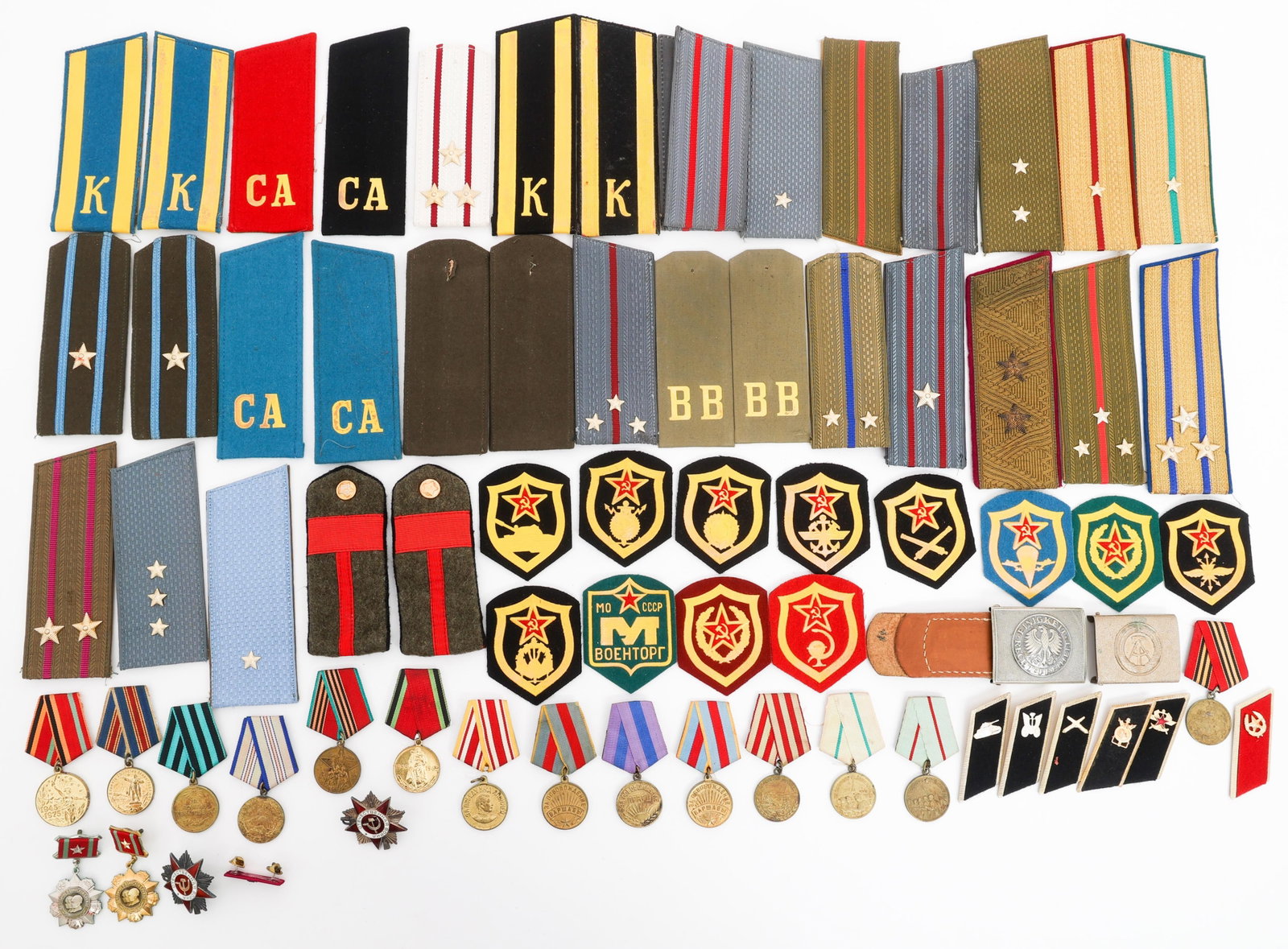 COLD WAR SOVIET SHOULDER TABS, INSIGNIA, & MEDALS: COLD WAR SOVIET SHOULDER TABS, INSIGNIA, & MEDALS Cold War Soviet Insignia, Patches, Epaulettes, Medals, East German Belt Buckles, and Collar Tabs. Epaulet ranks include Russian Military Cadet, Colone