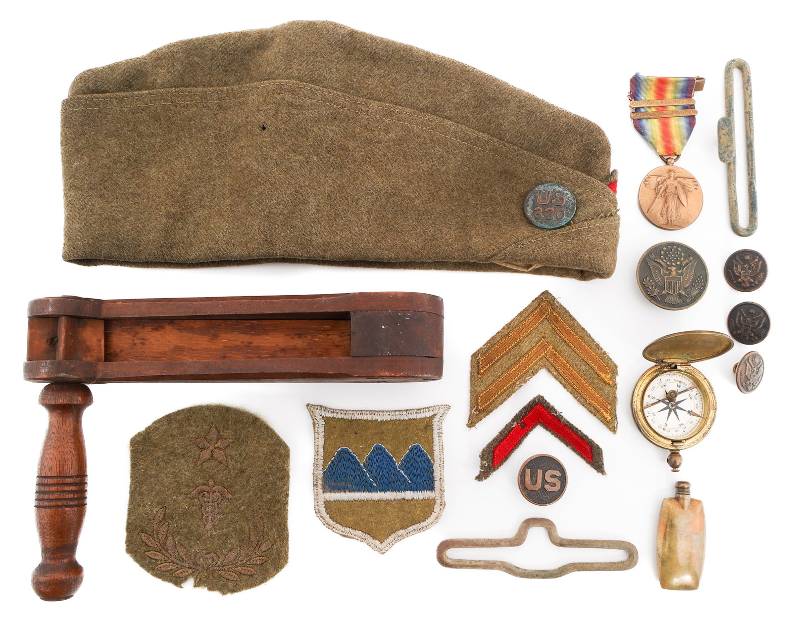 WWI US ARMY CAP MEDALS, PATCHES & GAS ALARM RATTLE: WWI US ARMY CAP MEDALS, PATCHES & GAS ALARM RATTLE WWI U.S. Army Cap, Medals, Patches and Gas Alarm Rattle. Includes (1) U.S. Army Garrison Cap with a US 320 Collar Disc, and Enlisted Medical Corps Co