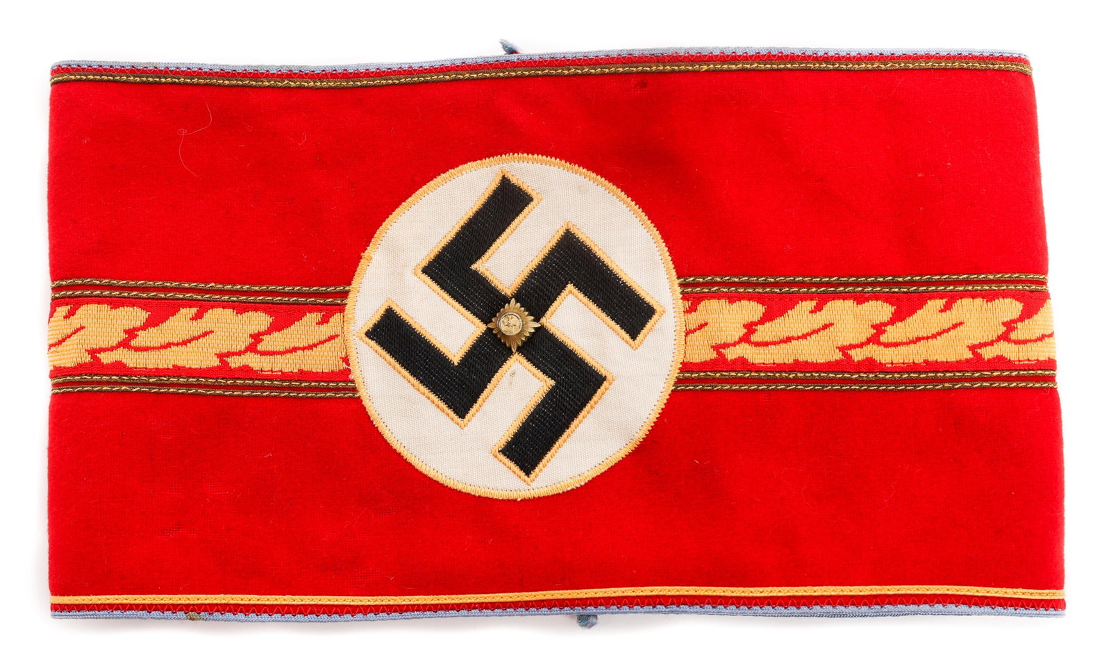 WWII GERMAN NSDAP ORTSGRUPPENLEITER ARMBAND: WWII GERMAN NSDAP ORTSGRUPPENLEITER ARMBAND WWII German NSDAP Ortsgruppenleiter Armband. Red wool / felt construction with blue piping, machine embroidered white rayon disc overlaid by a black machine