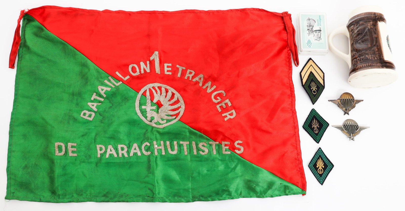 COLD WAR FRENCH FOREIGN LEGION FLAG & JUMP WINGS: COLD WAR FRENCH FOREIGN LEGION FLAG & JUMP WINGS Cold War French Foreign Legion Parachutist Flag, Pins, Patches and Numbered Jump Wings. (1) French 1st Batallion Etranger De Parachutistes. Multiple pi