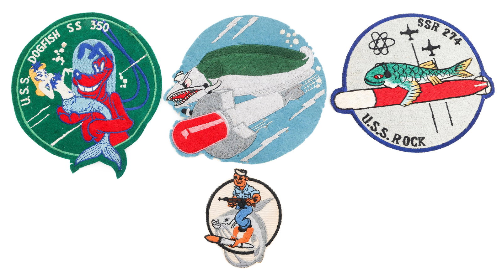 WWII - COLD WAR US NAVY SUBMARINE PATCHES: WWII - COLD WAR US NAVY SUBMARINE PATCHES WWII to Cold War U.S. Navy Submarine Patches. Includes U.S.S. Rock Patch, U.S.S. Dogfish Patch, U.S.S. Catfish Patch, and one novelty patch. Provenance: Lifet