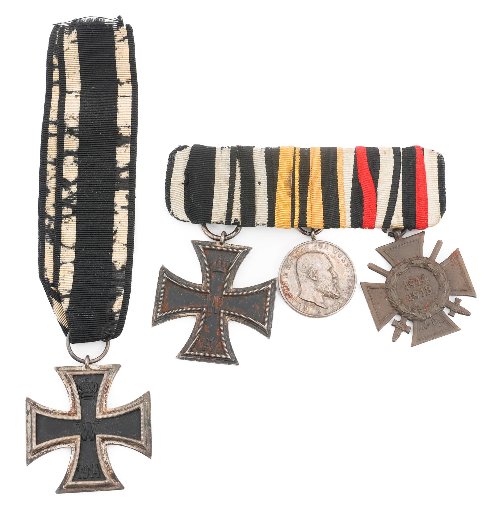 WWI GERMAN IRON CROSS & ARMY MEDAL BAR: WWI GERMAN IRON CROSS & ARMY MEDAL BAR WWI German Army Medals. Includes (2) Iron Cross Second Class Medals, Dated 1914. (1) Honor Cross, (1) King Wilhelm the II Medal for Bravery and Loyalty.