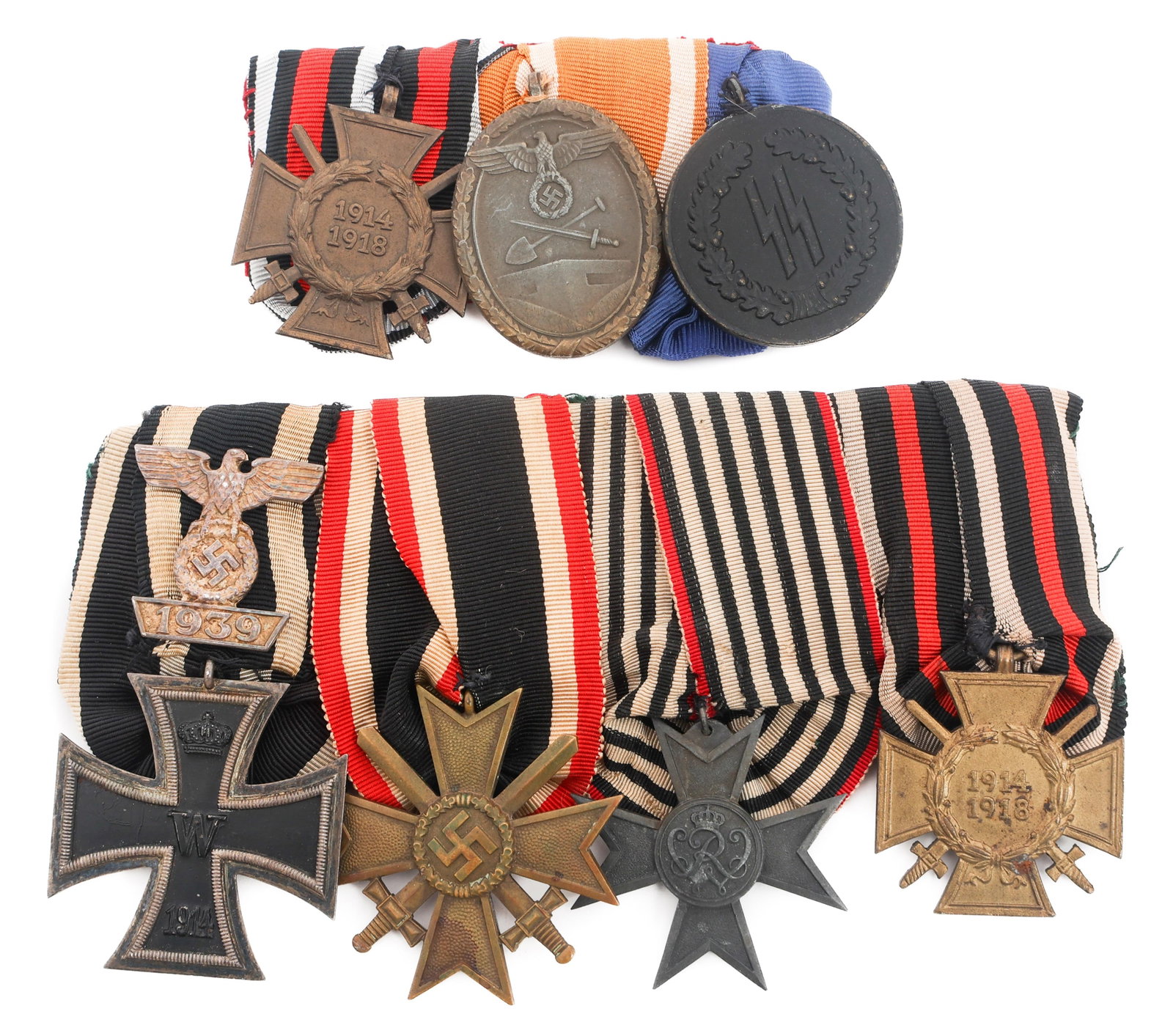 WWI - WWII GERMAN WEHRMACHT & SS MEDAL BARS: WWI - WWII GERMAN WEHRMACHT & SS MEDAL BARS WWII German Wehrmacht & SS Medal bars. (1) German SS three Medal bar. Honor Cross for WW1 Service, Defense Wall Honor Award for service and SS Long Service 