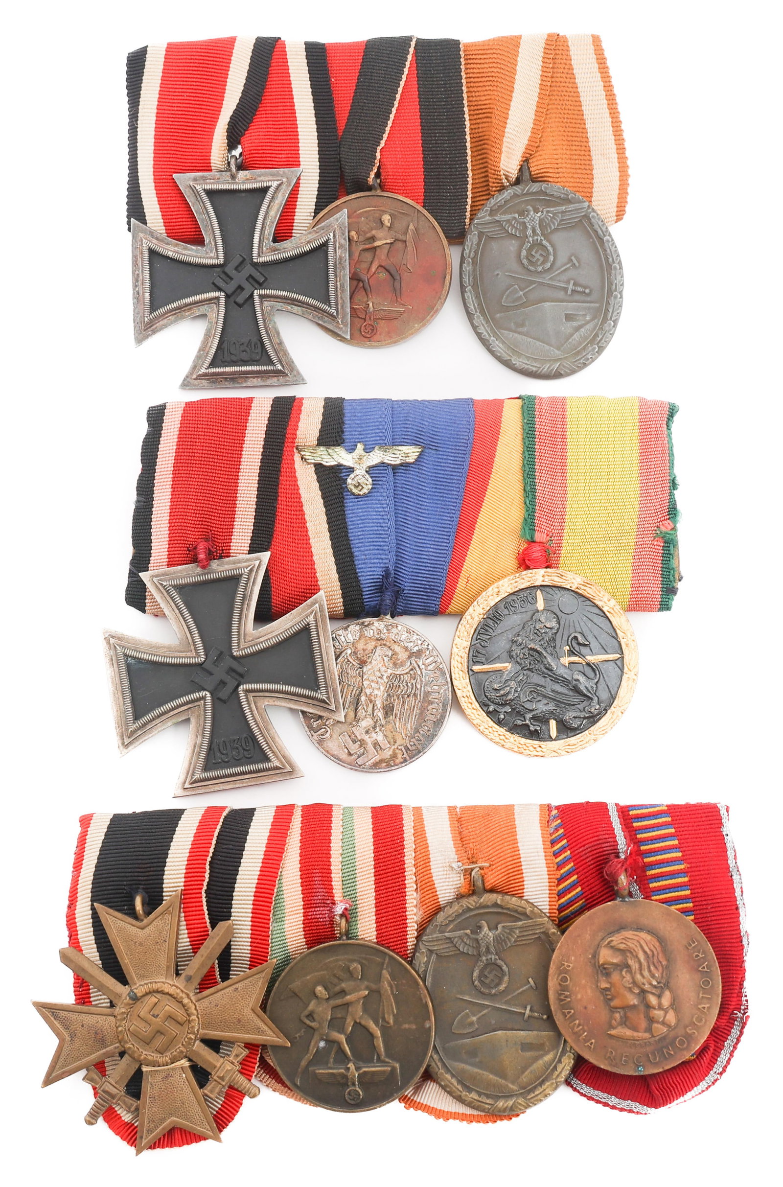 WWII GERMAN WEHRMACHT AWARDS MOUNTED MEDAL BARS: WWII GERMAN WEHRMACHT AWARDS MOUNTED MEDAL BARS WWII German Wehrmacht Awards Mounted Medal Bars. (1) WWII German three medal bar. Iron Cross 2nd Class, Commemorative Medal of 1 October 1938 and Defens