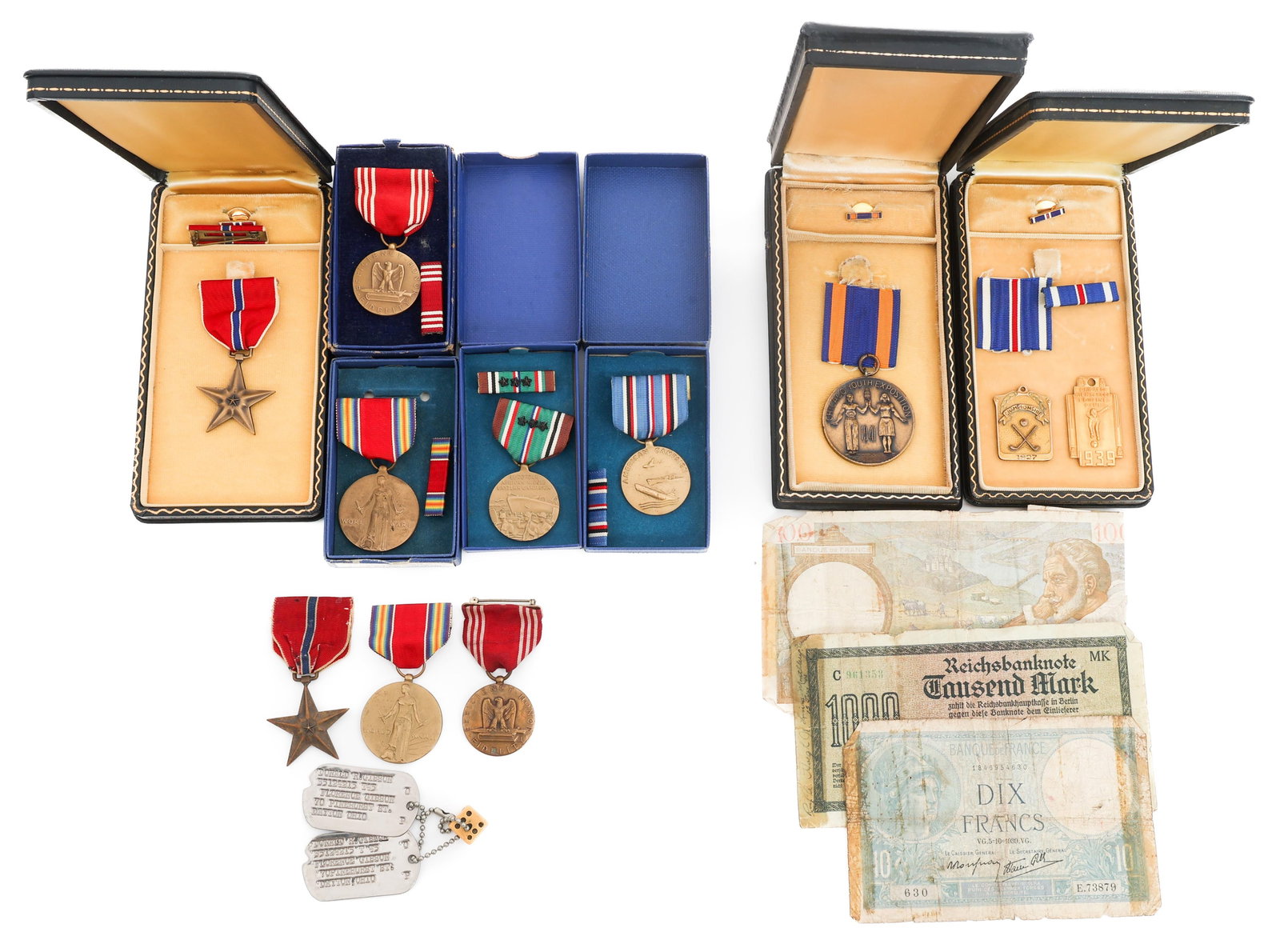 WWII US ARMED FORCES NAMED MEDALS & BANK NOTES: WWII US ARMED FORCES NAMED MEDALS & BANK NOTES WWII U.S. Armed Forces Named Medals, Civilian Medals and German and French Bank Notes. (1) Bronze Star in Coffin Style Box. Named to Donald E. Leedom, 39