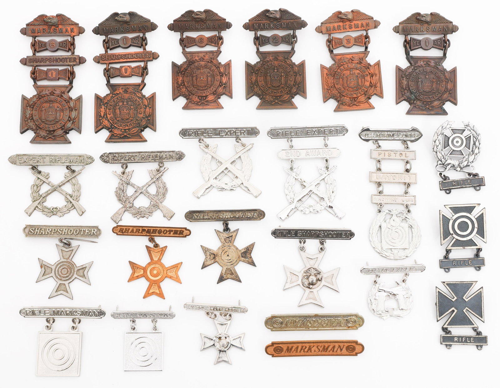 WWI US ARMY NG & USMC MARKSMAN QUALIFICATION BADGE: WWI US ARMY NG & USMC MARKSMAN QUALIFICATION BADGE Early 20th Century to WWI U.S. Army, National Guard and Marine Corps Sharpshooter Badges. (6) New York National Guard Small Arms Practice Badges. Mak