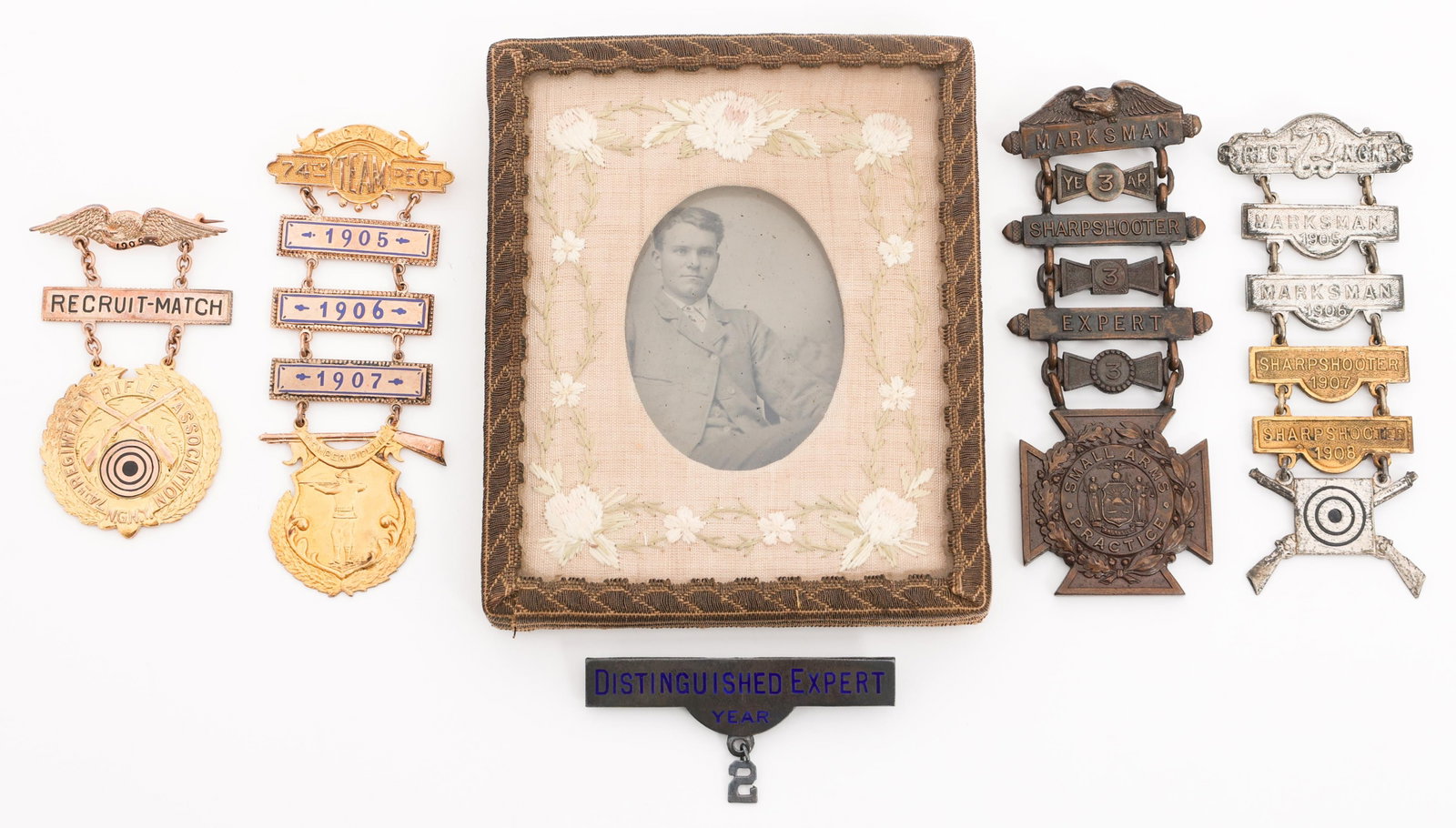 14k GOLD PRE-WWI US & NYNG MARKSMAN BADGES: 14k GOLD PRE-WWI US & NYNG MARKSMAN BADGES 14k Gold Pre WWI US & New York National Guard Marksman Badges. Named to L. B. McDannell. (1) 14k Gold 74th Regimental Team 1905 - 1907 Marksman Badge. Named 