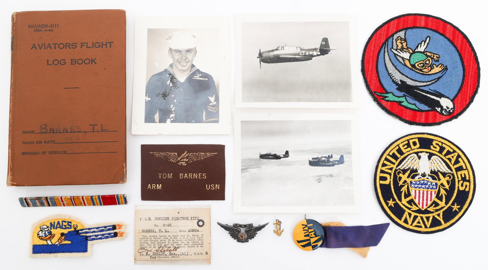 WWII USN VT-11 AIRCREW FLIGHT LOG BOOK & INSIGNIA: WWII USN VT-11 AIRCREW FLIGHT LOG BOOK & INSIGNIA WWII USN VT-11 Aircrew Flight Log Book, Patches and Insignia. (1) Aviators Flight Log Book. (1) Combat Air Crew Wings. (1) Tom Barnes Name Tape. (1) V