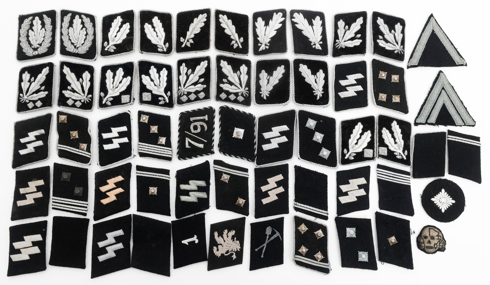 RE-ENACTOR WWII GERMAN SS COLLAR TAB PAIRS: RE-ENACTOR WWII GERMAN SS COLLAR TAB PAIRS Modern Re-enactor WWII German SS Officer and Enlisted Collar Tabs Pairs. With ranks from OberSturmFuhrer to HauptSturmFuhrer to Runic SS NCO. (15) Pairs.