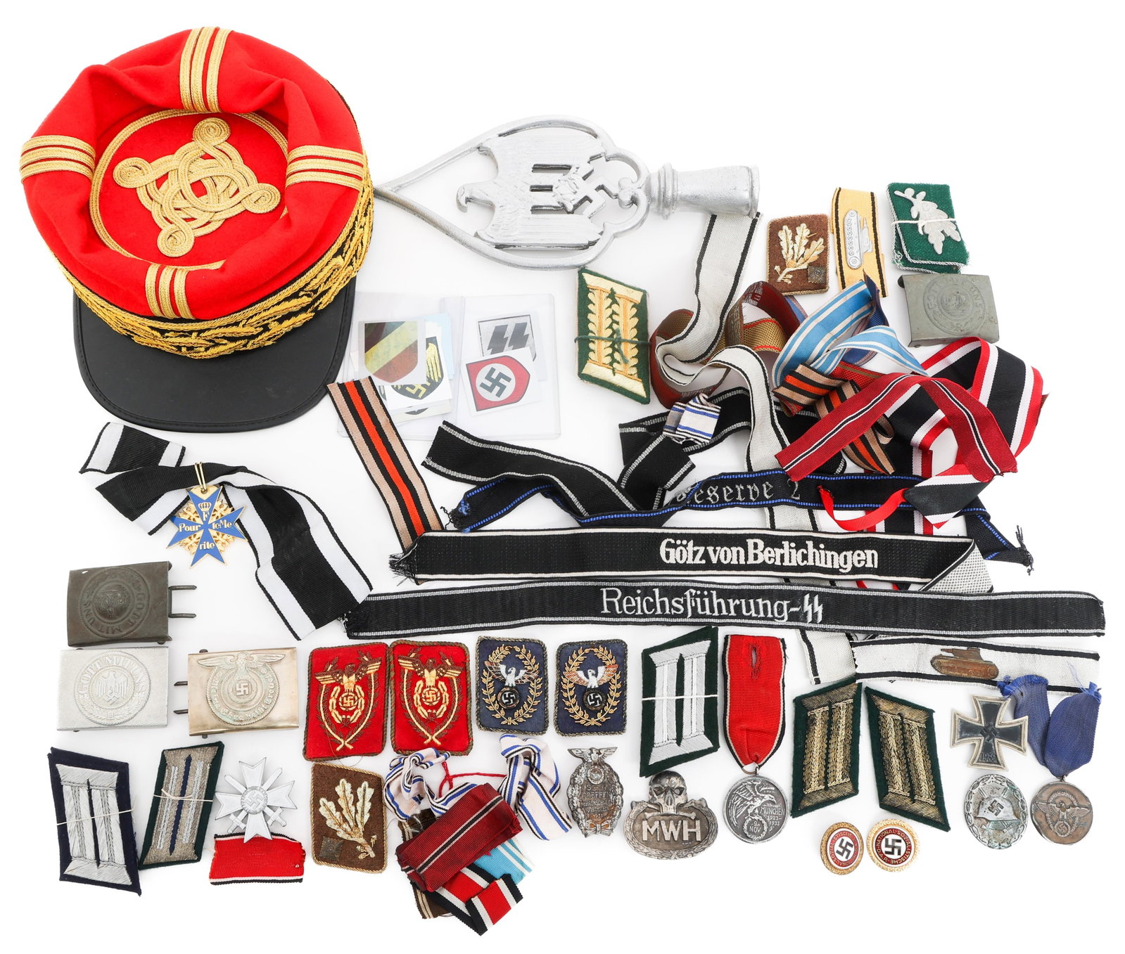 RE-ENACTOR WWII GERMAN BUCKLES, RANK & UNIT TABS: RE-ENACTOR WWII GERMAN BUCKLES, RANK & UNIT TABS Modern re-enactor WWII German Belt Buckles, Medals, Unit and Rank Shoulder tabs, Collar tabs, and Cuff Title Insignia. Belt Buckles include Meine Ehre