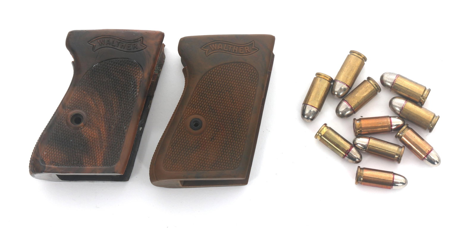 WALTHER MODEL PPK GRIPS & INERT AMMUNITION: WALTHER MODEL PPK GRIPS & INERT AMMUNITION Walther Model PPK grips with .32 Auto and .380 ACP caliber ammunition. Five inert 32 Auto caliber bullets. Five inert .380 ACP caliber bullets.