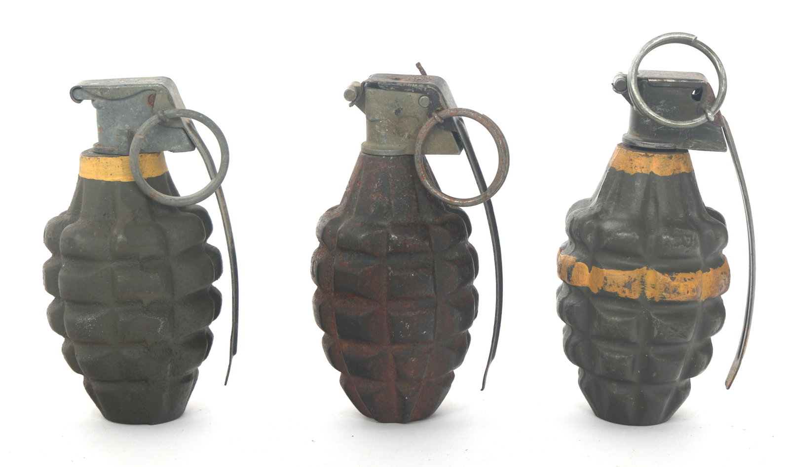 WWII US MKII FRAGMENTATION GRENADES - INERT: WWII US MKII FRAGMENTATION GRENADES - INERT Three WWII US fragmentation MkII grenades. A) Yellow band painted MkII fragmentation grenade with M200A1 fuze. Inert. B) Yellow band painted MkII