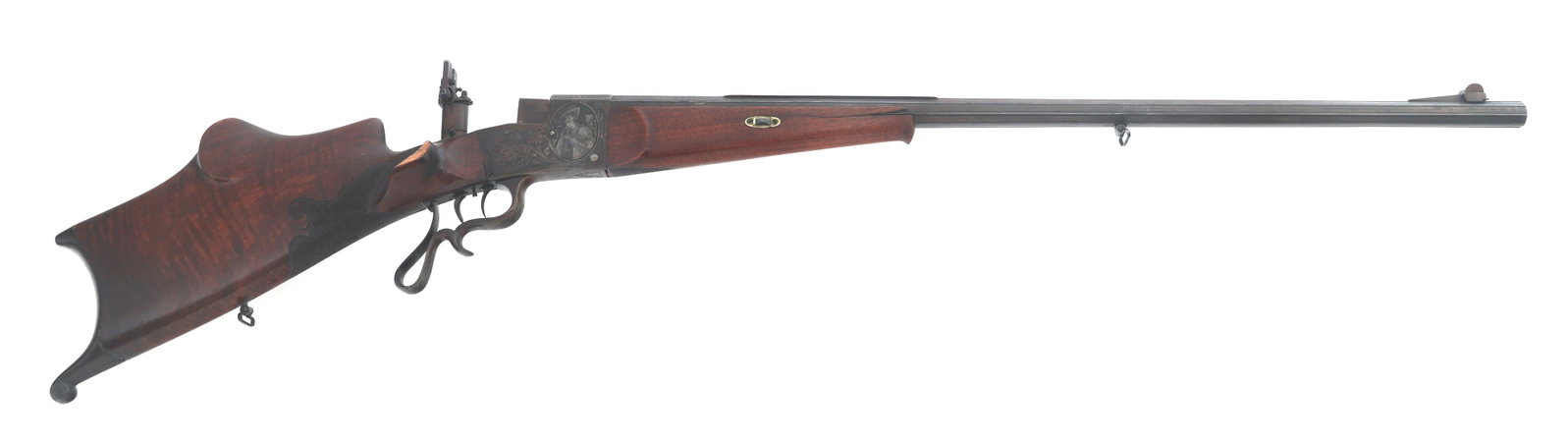 GERMAN 7.6mm CALIBER SCHUETZEN RIFLE: GERMAN 7.6mm CALIBER SCHUETZEN RIFLE German 7.6mm caliber single shot Schuetzen rifle. 32" octagonal barrel. Engraved receiver. Serial number matches on barrel, receiver, falling block, and wedge. Bar