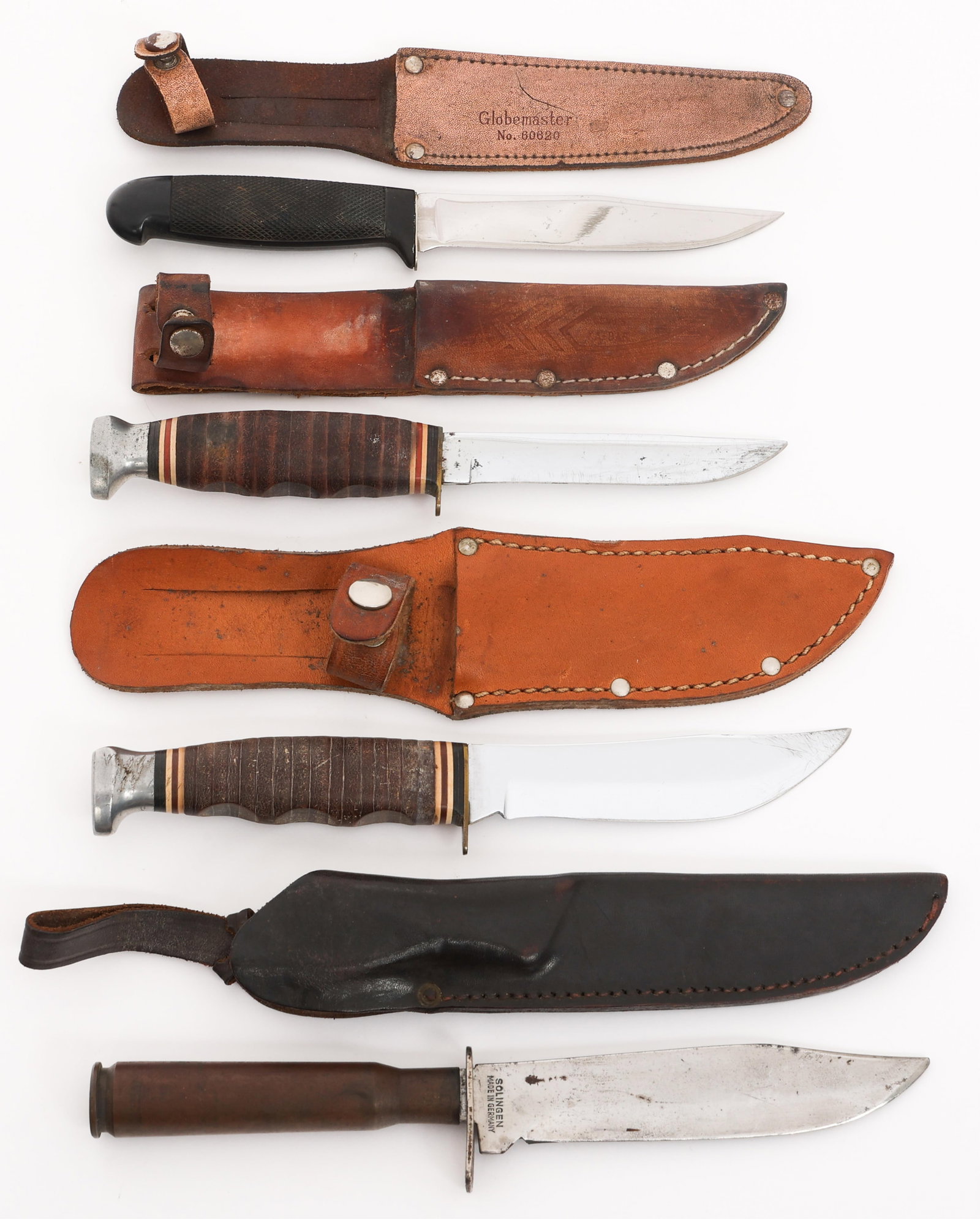 HUNTING & SKINNING KNIVES WITH SHEATHS: HUNTING & SKINNING KNIVES WITH SHEATHS Hunting and Skinning Knives. (2) Ka-Bar Skinning Knives. Single edged blades. Maker marked by Ka-Bar on the ricassos. Stacked leather handles with alloy