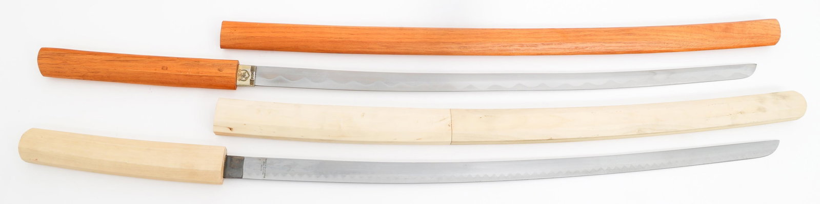 MODERN REENACTOR WOODEN KATANAS: MODERN REENACTOR WOODEN KATANAS Two Modern Reenactor Wooden Katanas. Single edged blade. Marked China on the ricassos. Wooden handles and scabbards. Blade Length: 27" Total Length: 36 1/2"