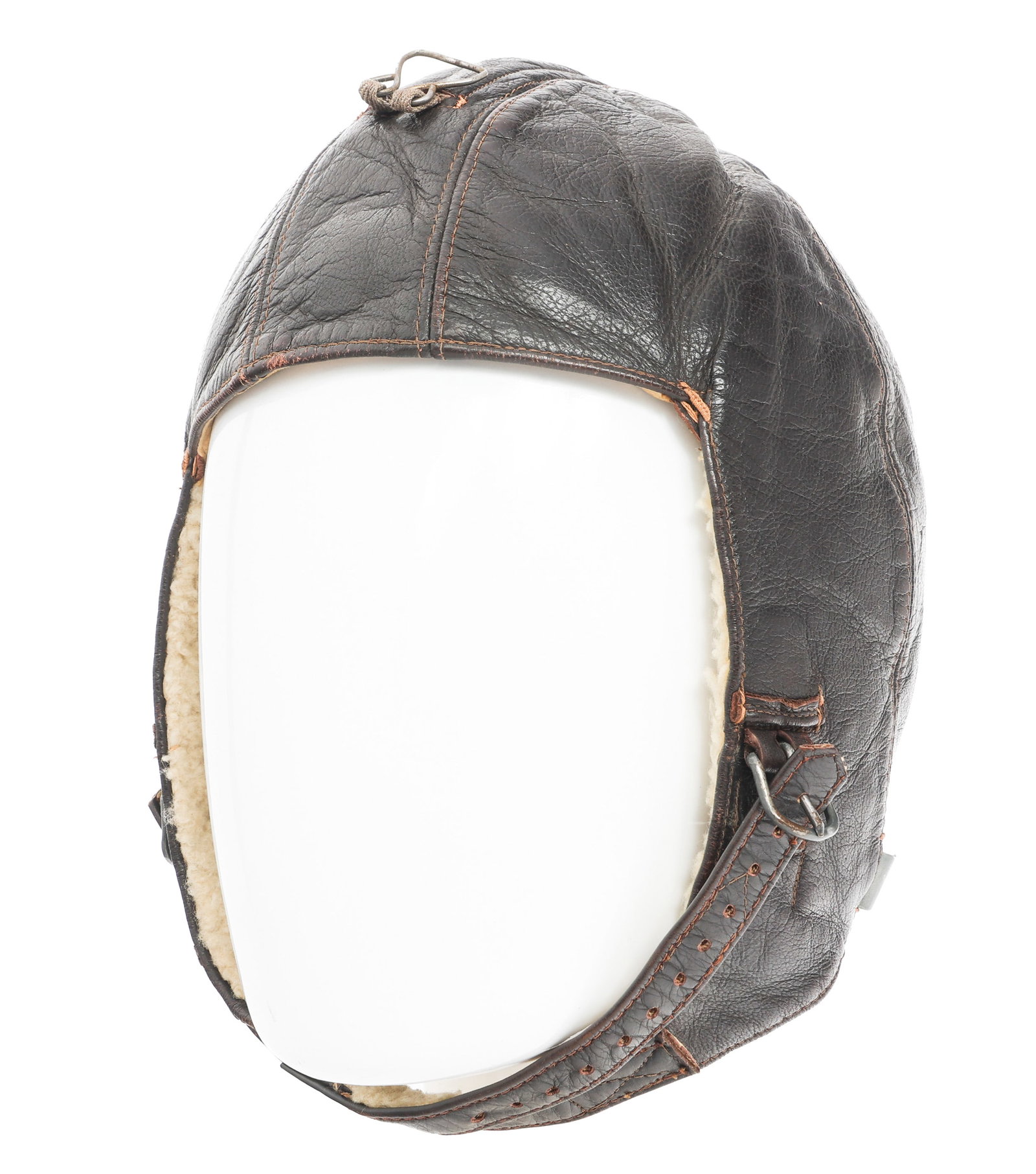 WWII GERMAN LUFTWAFFE K33 WINTER FLYING HELMET: WWII GERMAN LUFTWAFFE K33 WINTER FLYING HELMET WWII German Luftwaffe K33 Winter Flying Helmet. Leather and sheepskin. Chinstrap. Ridge strap with pull ring. Makers tag by Neumann & Feymer, Berlin. Siz