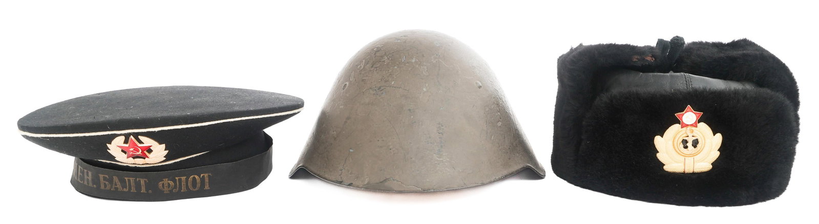 COLD WAR SOVIET & EAST GERMAN HEADGEAR: COLD WAR SOVIET & EAST GERMAN HEADGEAR Cold War Soviet and East German Armed Forces Headgear. (1) M56/76 Combat Helmet. Leather and foam liner with plastic support. "Liemen" handwritten on liner. (1) 