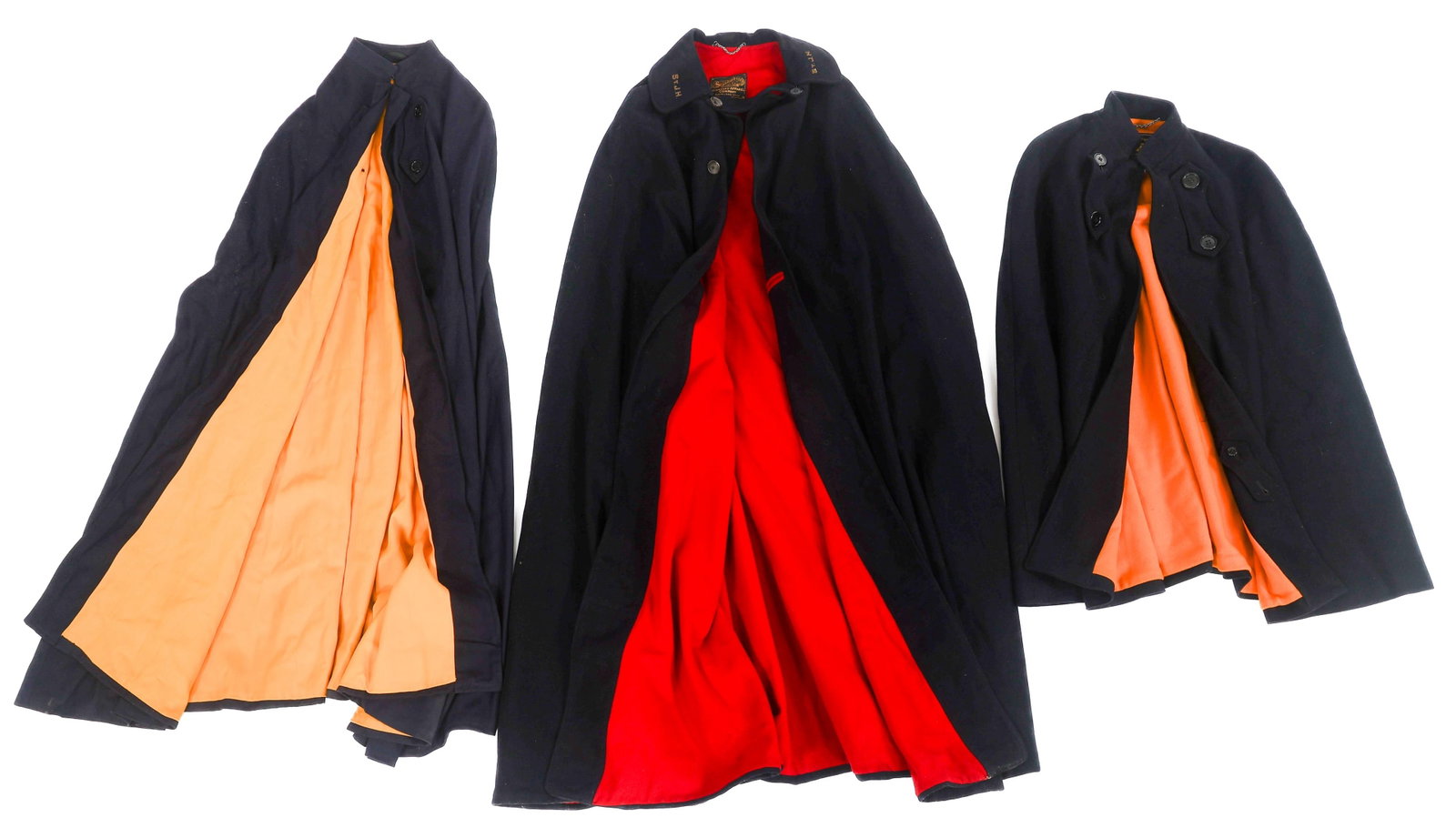 WWII US NURSE HOSPITAL CAPES: WWII US NURSE HOSPITAL CAPES WWII US Nurse Hospital Capes. (1) St. Johns Hospital Cape. Dark blue wool with red liner. Bullion "St. J.H." embroidered on the collar. Tailor marked by Standardized. (1) 