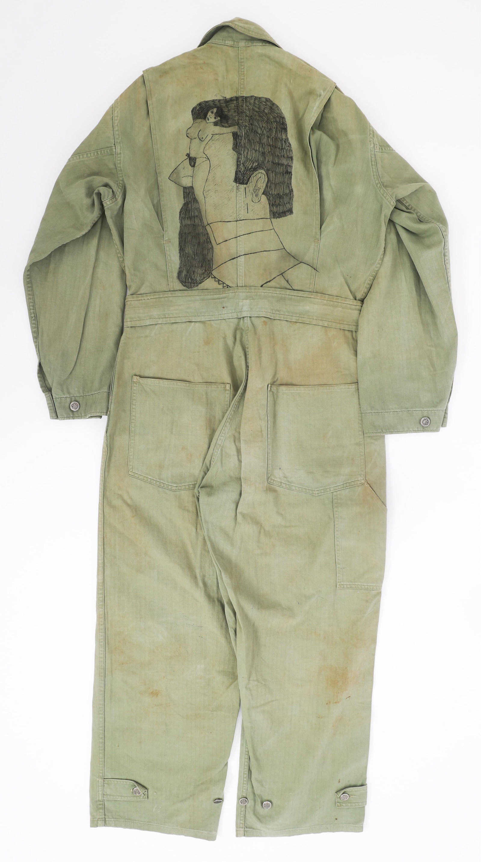 WWII US ARMY HBT COVERALLS WITH PINUP GIRL ARTWORK: WWII US ARMY HBT COVERALLS WITH PINUP GIRL ARTWORK WWII US Army HBT Coveralls. 13 star alloy based buttons. C Hilton H 34606871 written on the left chest pocket. Pin up girl artwork hand drawn on the 