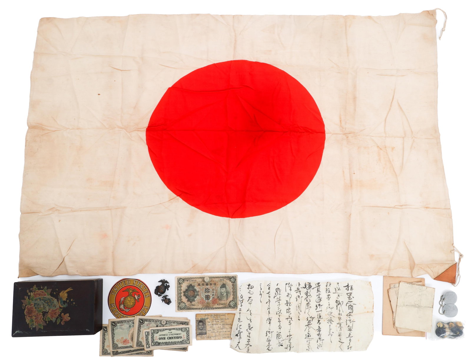 WWII USMC ATTRIBUTED BRING BACK FLAG GROUPING: WWII USMC ATTRIBUTED BRING BACK FLAG GROUPING WWII USMC Attributed Bring Back Japanese Flag, Papers, and Currency Grouping. Attributed to US Marine Corps Private First Class Willie A. Reynolds. (1)