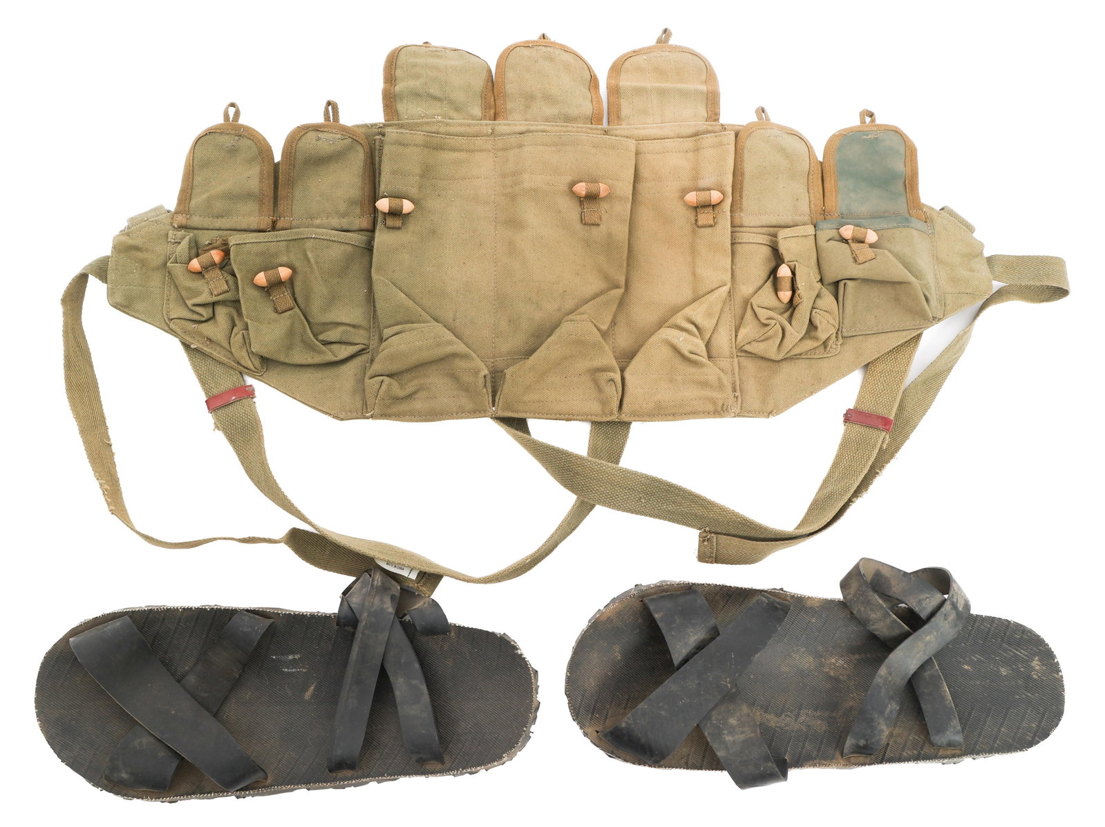 VIETNAM WAR NVA TYPE 56 AK-47 CHEST RIG & SANDALS: VIETNAM WAR NVA TYPE 56 AK-47 CHEST RIG & SANDALS Vietnam War North Vietnamese Army Gear. (1) Chinese Type 56 AK-47 Chest Rig. Faint factory stamp on the reverse. (1) NVA Ho Chi Minh Sandals. Rubber S