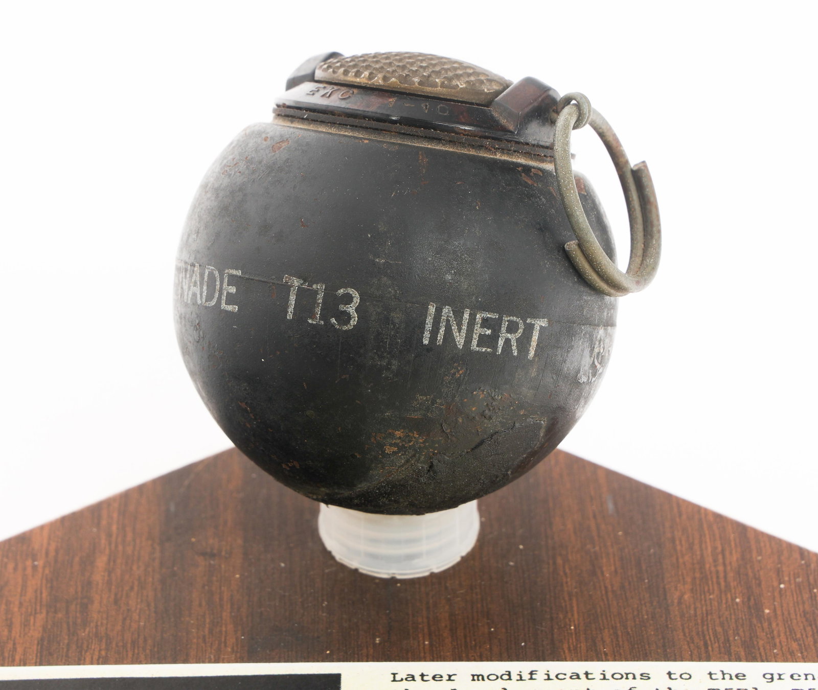 WWII US OSS T-13 BEANO EXPERIMENTAL HAND GRENADE: WWII US OSS T-13 BEANO EXPERIMENTAL HAND GRENADE WWII US Office of Strategic Services Experimental T-13 Beano Hand Grenade. Bakelite T5E2 fuze on steel body with various markings. Set on a display boa