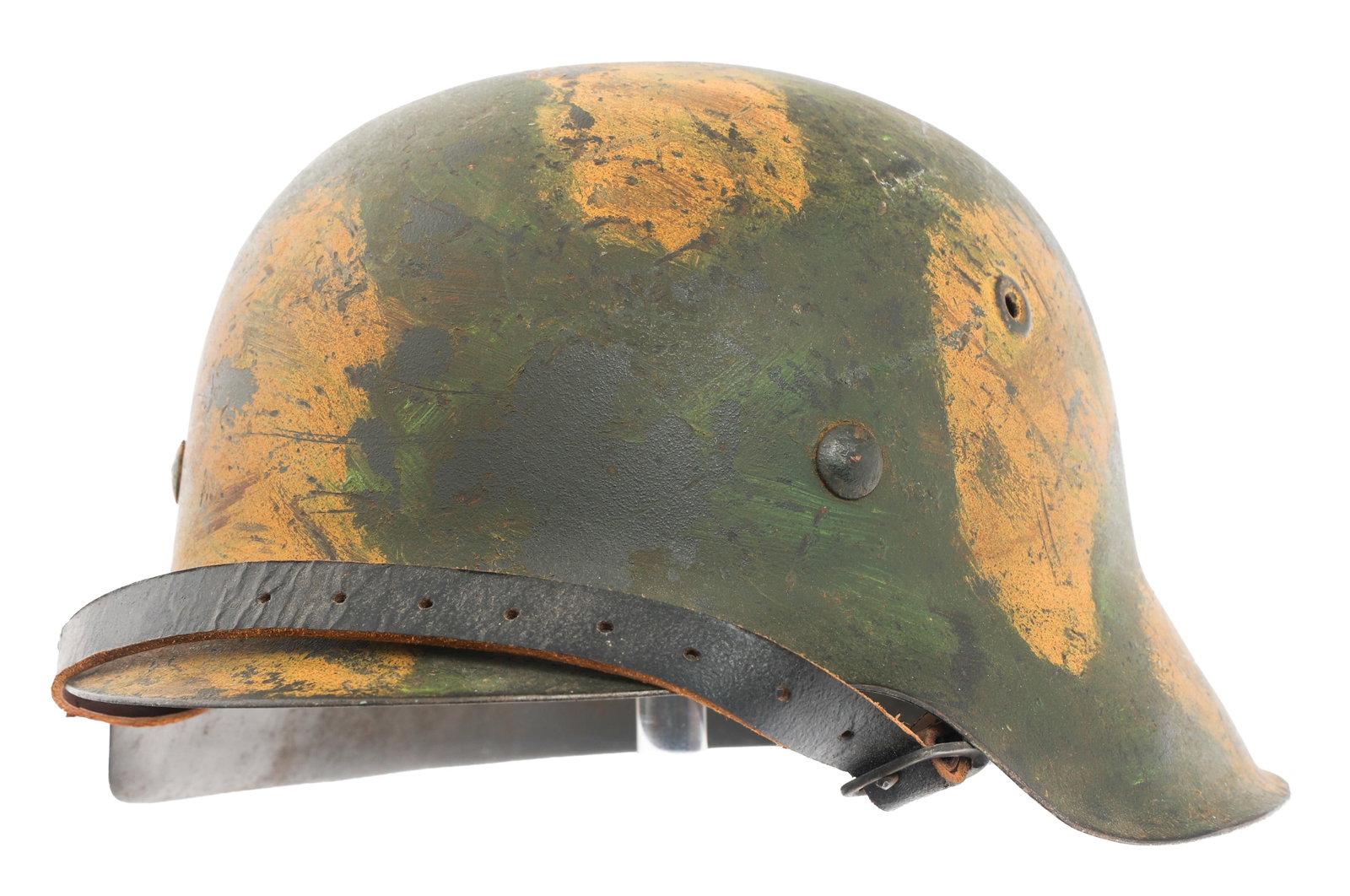 REFURBISHED WWII GERMAN SS SD M42 CAMO HELMET: REFURBISHED WWII GERMAN SS SD M42 CAMO HELMET Refurbished WWII German SS Single Decal M42 Camouflaged Helmet. SS decal on left side. Steel band, leather 8 tongue liner and chinstrap. Serial number 826