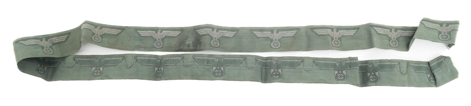 WWII GERMAN ARMY HEER BREAST EAGLE UNCUT RIBBON: WWII GERMAN ARMY HEER BREAST EAGLE UNCUT RIBBON WWII German Army Heer Breast Eagle Uncut Ribbon. Sand green uncut band of 16 Bevo cotton embroidered eagles. Size: 48"
